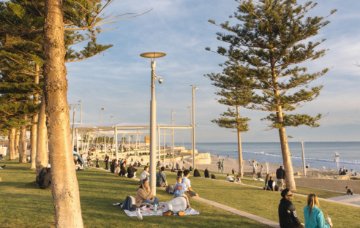Image of visitors watching the sunset at Scarborough Beach